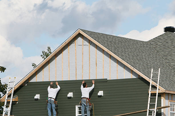 Professional Siding Replacement technician working in Russells Point, OH